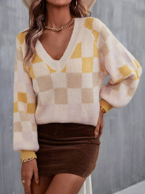 Geometric puff sleeve V-neck knit sweater in cream with yellow and tan checkerboard pattern.