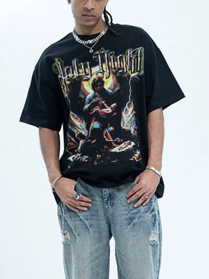 Black oversized graphic t-shirt with Holy Night print and distressed denim jeans.