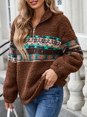 Brown sherpa quarter-zip pullover with Aztec print details and a zip neckline.