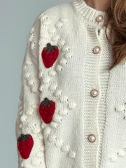 White knit cardigan with strawberry patches and pearl buttons