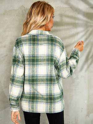 Collared jacket with green, blue, and cream plaid pattern, button front, and long sleeves.