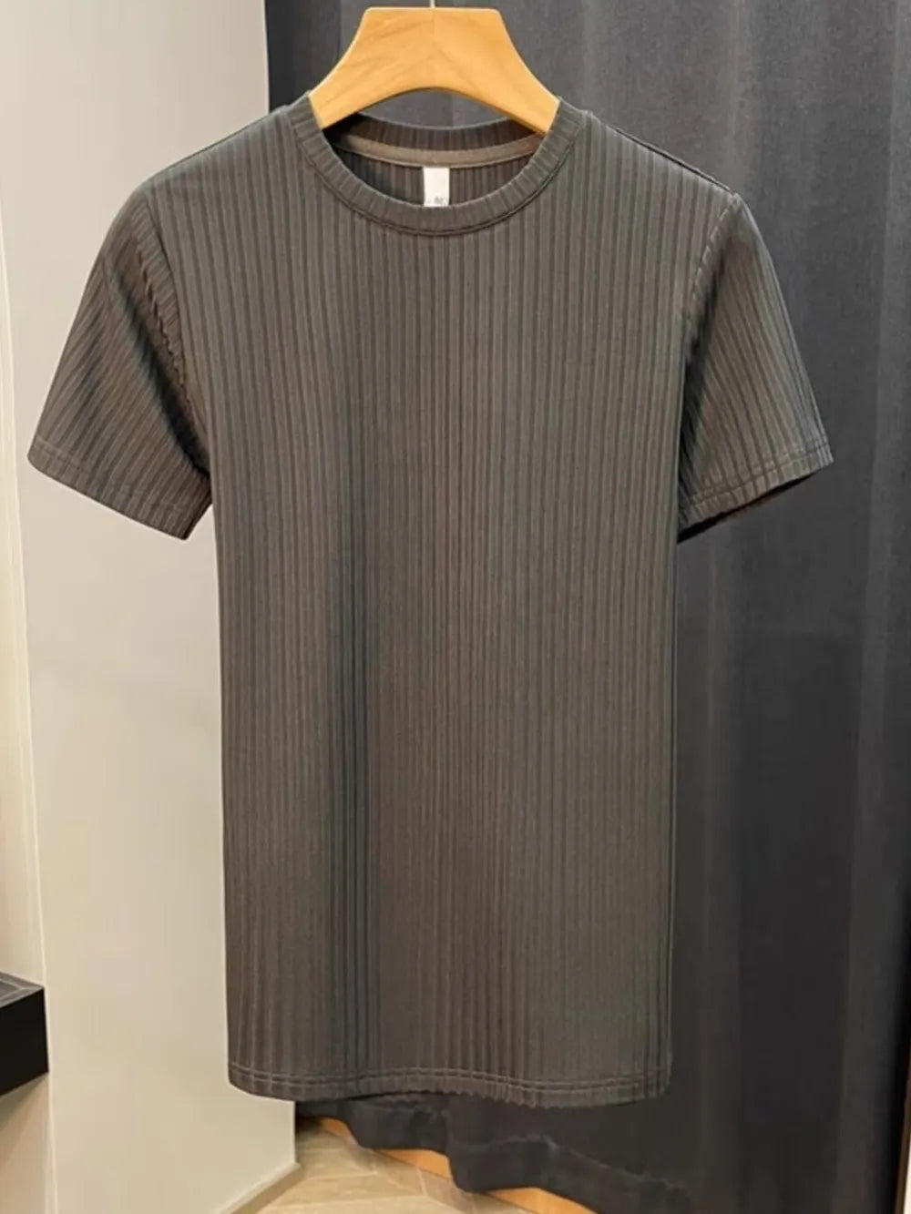 Men's dark gray ribbed knit t-shirt with crew neck and short sleeves.
