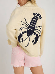 Cream knit cardigan with navy lobster appliqué on back, long sleeves, ribbed trim.