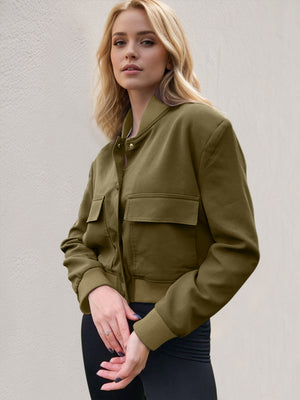 Boxy bomber jacket in moss green with two chest pockets and ribbed cuffs.