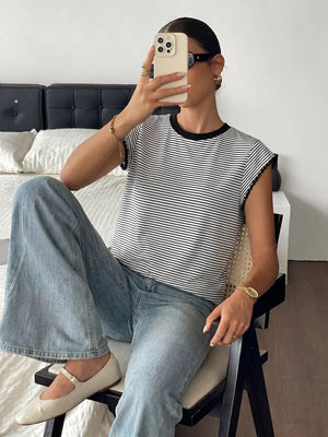 Black and white striped crew neck tee with black trim and short sleeves.