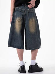 Relaxed fit dark blue denim shorts with distressed wash and pocket details.