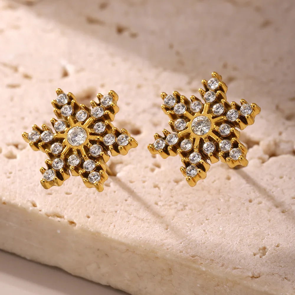 Celestial Gemstone Snowflake Studs earrings in 18K gold-plated metal with clear gemstones.