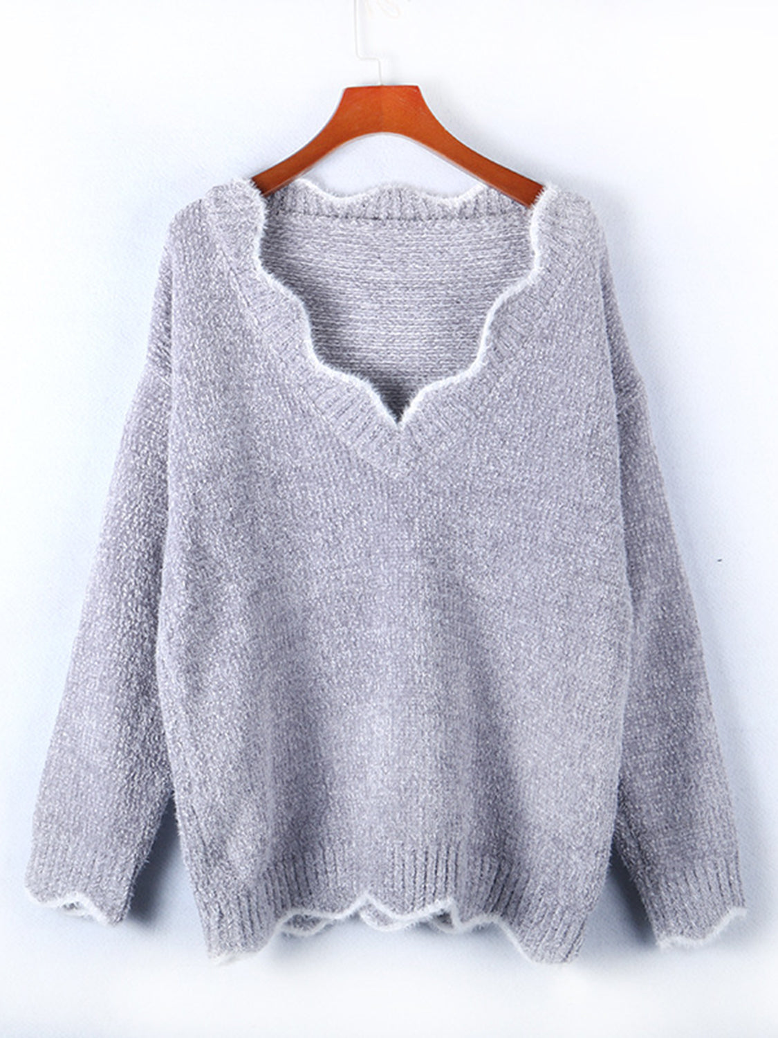 Scalloped trim V-neck sweater in Cloudy Blue acrylic with fuzzy texture.