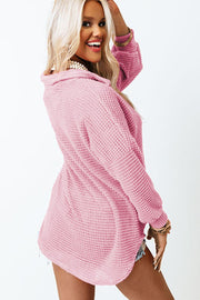 Blush pink waffle knit button-down shirt jacket with a relaxed fit.