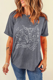 Gray t-shirt with white western tattoo graphic featuring a bull skull, boots, hearts, and horseshoe.