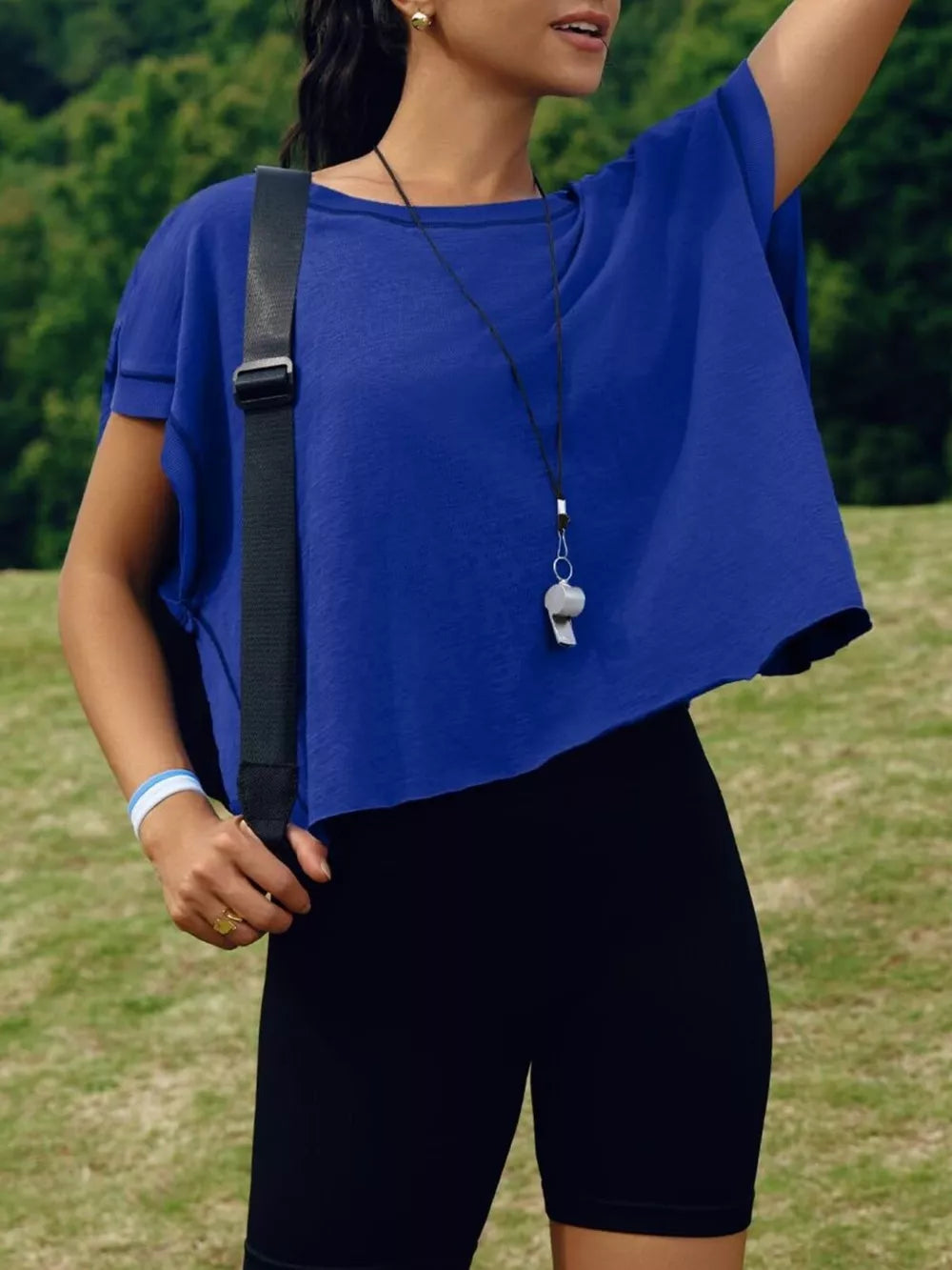 Royal blue t-shirt with exposed seams and cutout back detail.