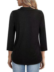 Black textured polo top with 3/4 sleeves and a zip front, shown from the back.