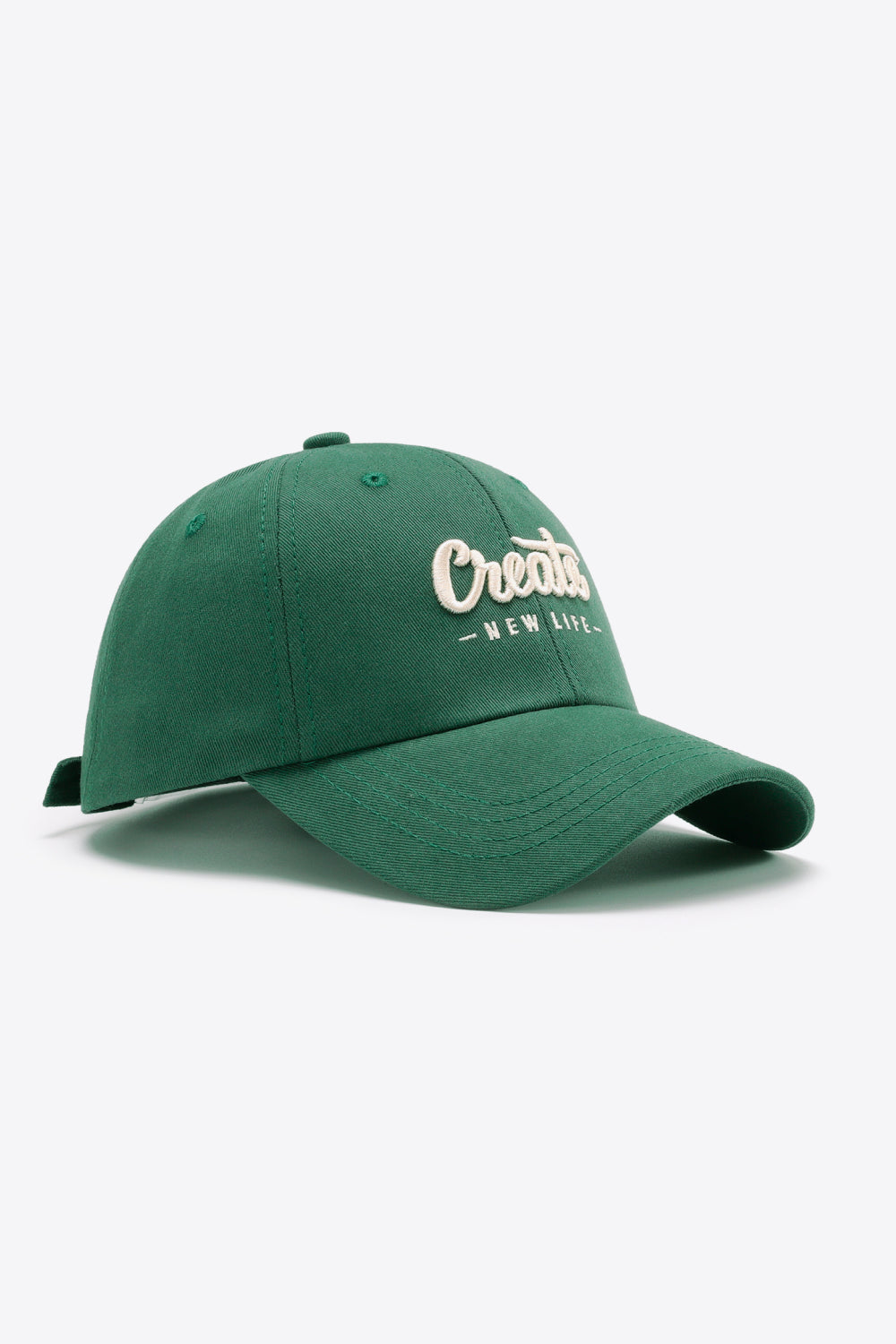 Green baseball cap with embroidered "Create New Life" text detail