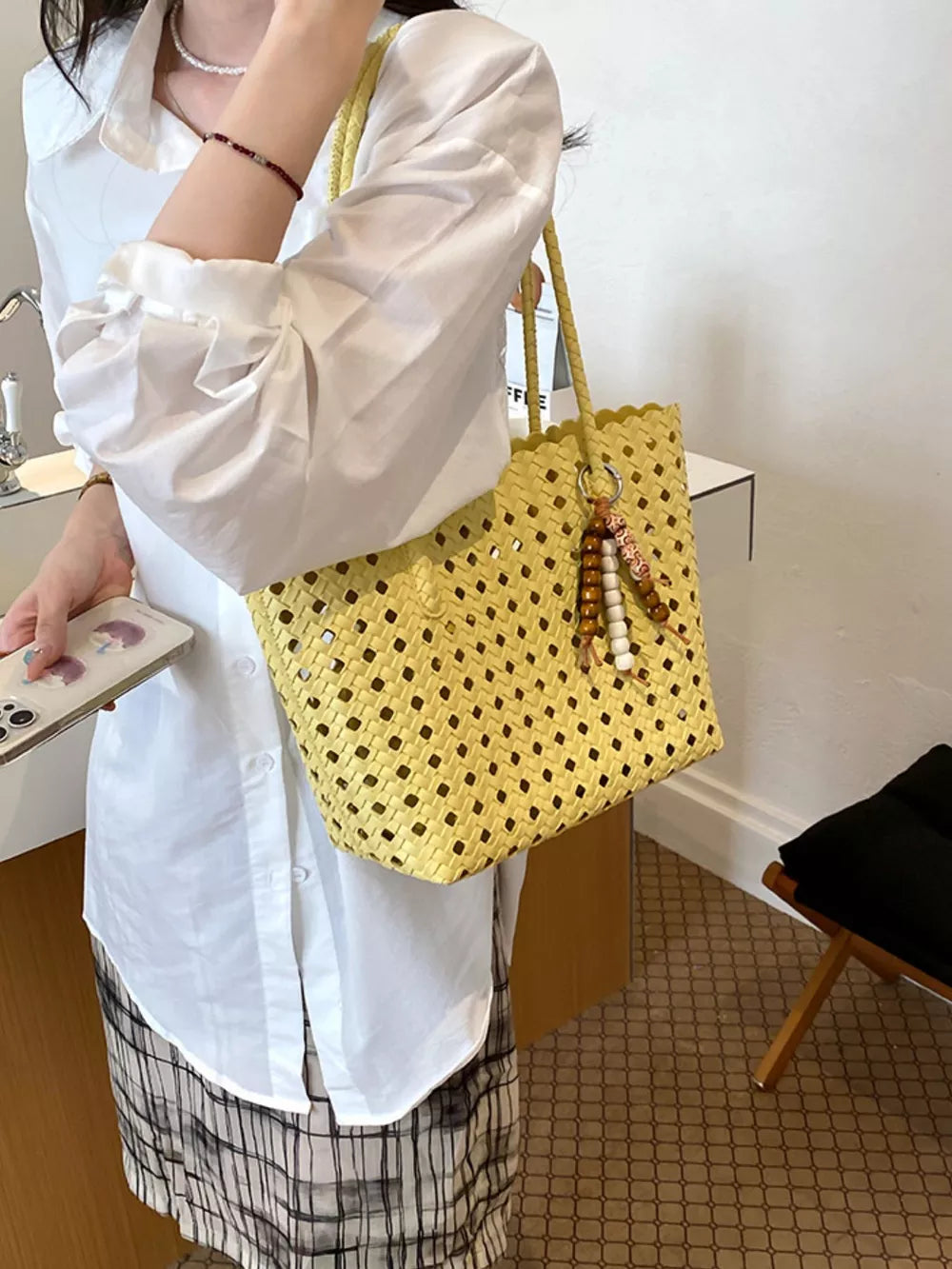 Cutout Leather Shoulder Bag in Yellow, model styling view
