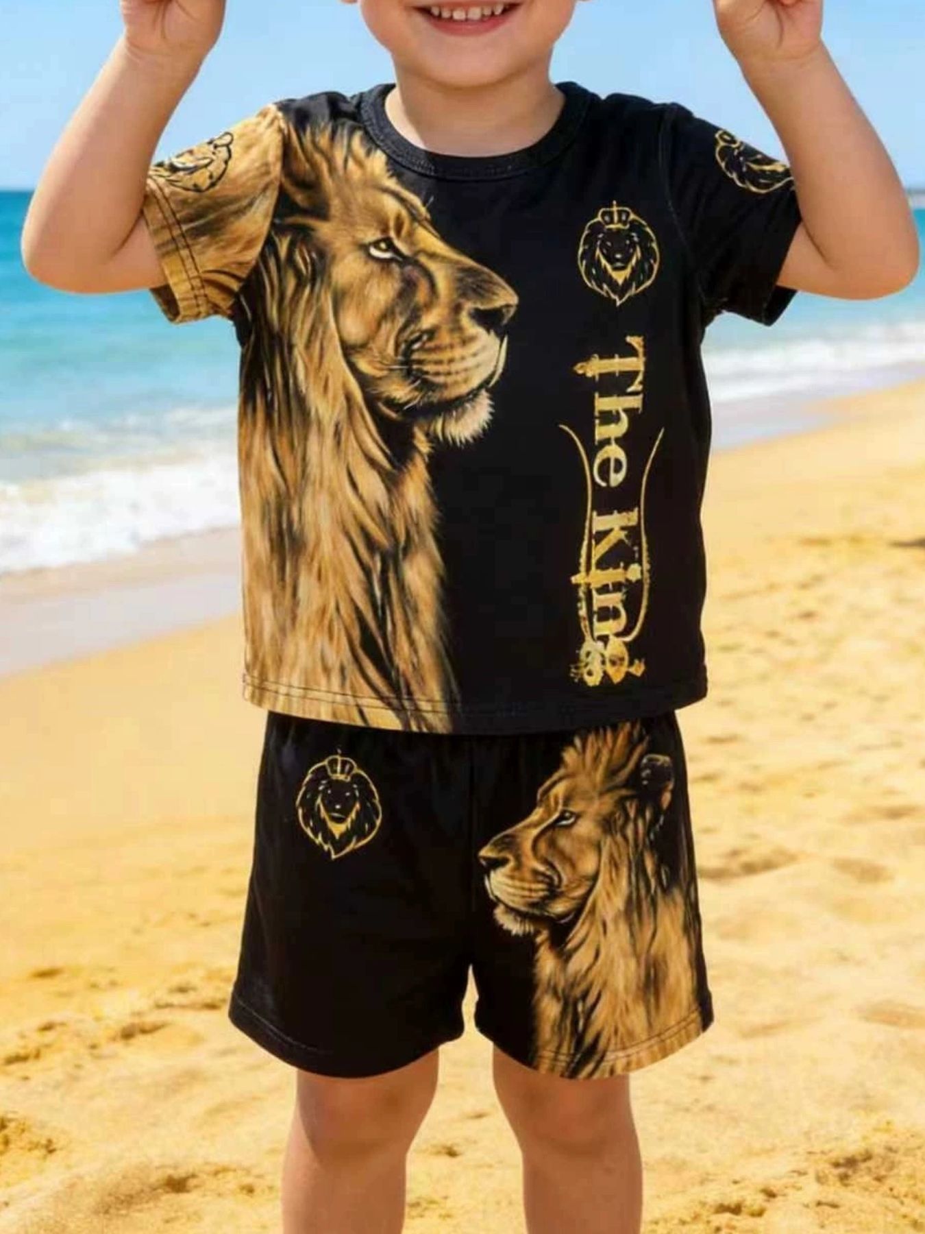 Black baby t-shirt and shorts set with regal lion graphic and "The King" text.