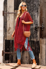 Rust open knit chevron fringe cardigan with short sleeves and open front.