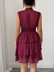Dark Red ruffled tiered sleeveless dress with smocked waist and mock neck.