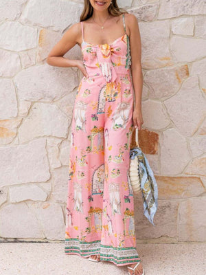 Pink architectural print tie-front wide-leg jumpsuit with bow detail and floral trim