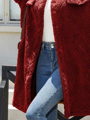 Burgundy quilted teddy bear coat with button front and patch pockets.