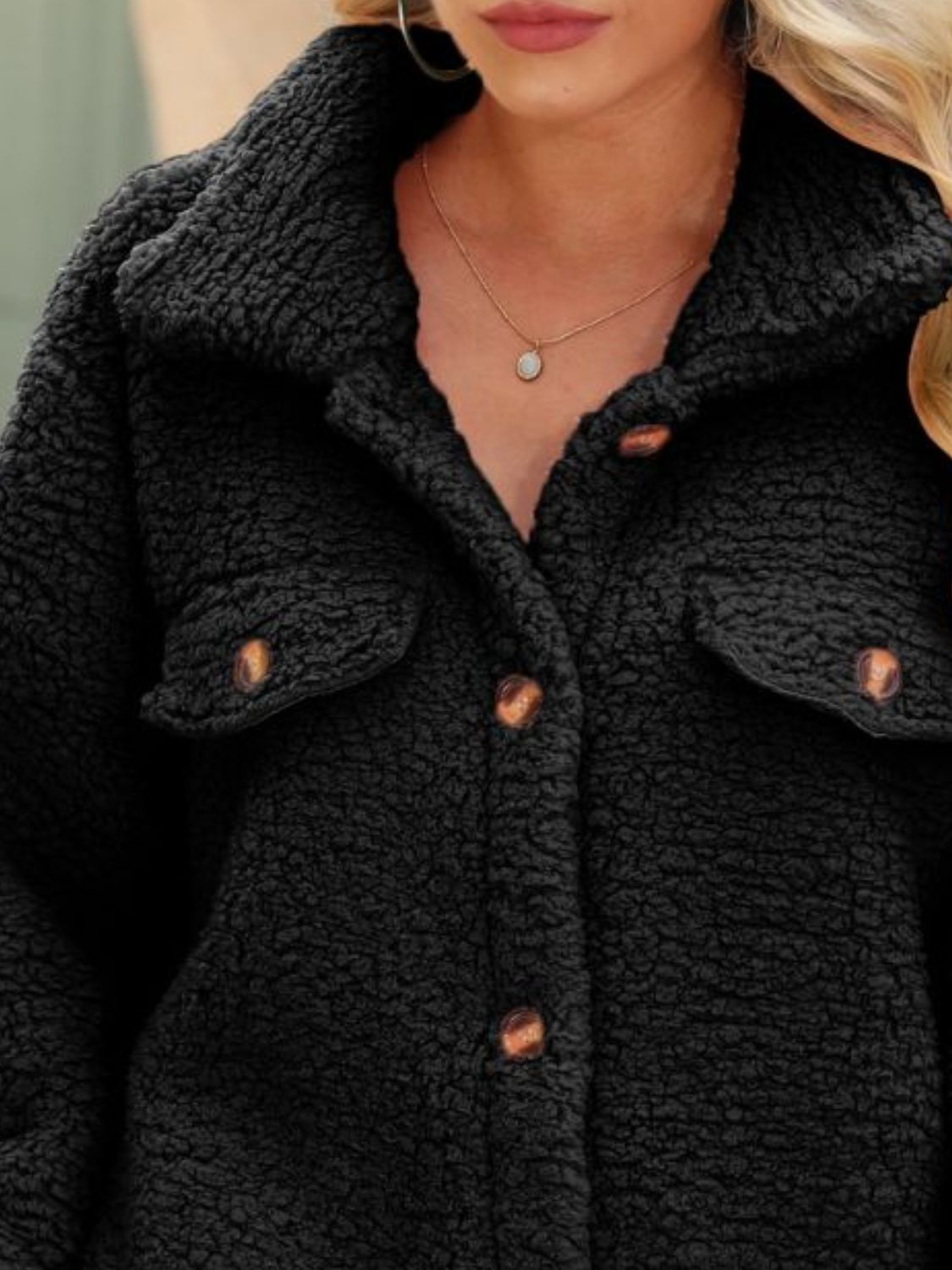 Black teddy texture shacket with button front and chest pockets.