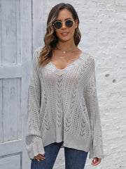 Openwork chevron knit sweater in dark gray with a V-neck and long sleeves.