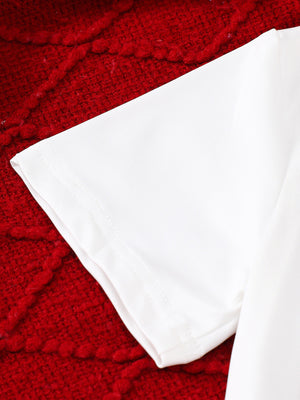 White cotton baby t-shirt sleeve detail on red textured background
