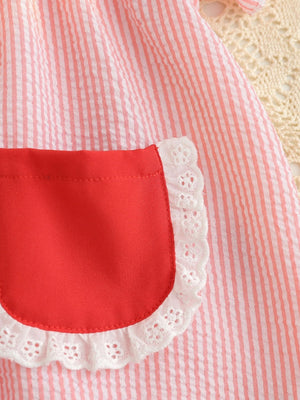 Baby dress in blush pink and white stripes with a red pocket and white lace trim.