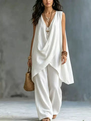White asymmetrical tunic top and wide-leg pants set with draped neckline