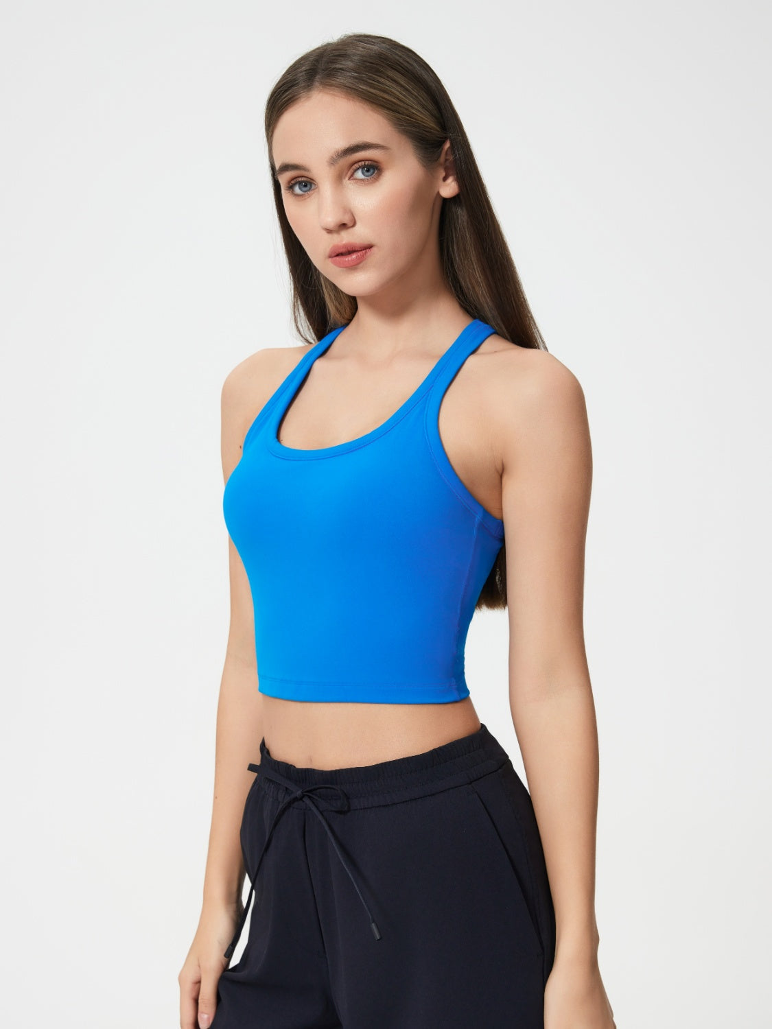Royal blue sculpted racerback crop tank top with a scoop neckline.