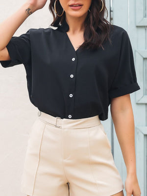 Black short sleeve button-up blouse with a notch neckline and cuffed sleeves.