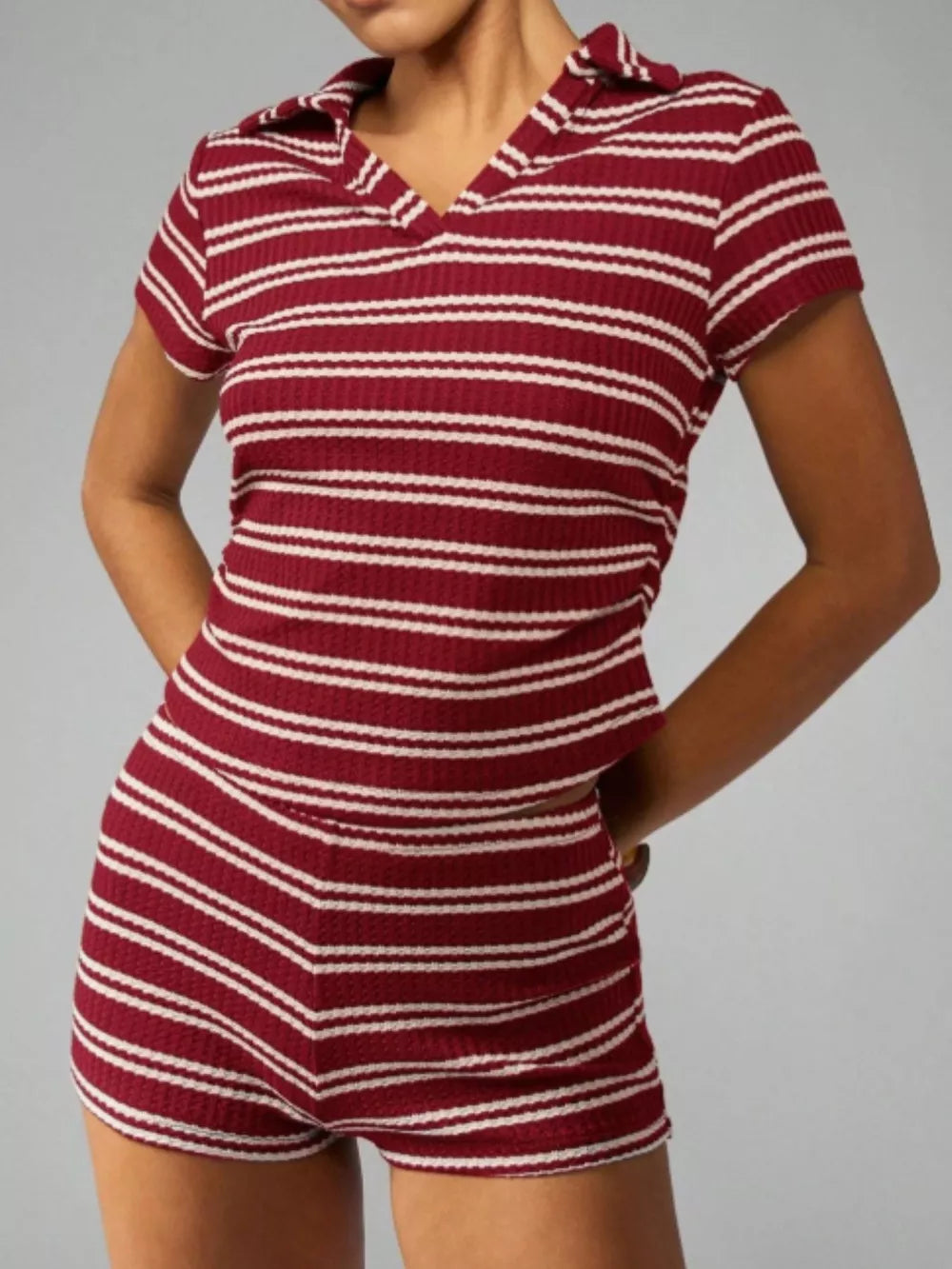 Burgundy striped knit two-piece set with a collared short-sleeve top and shorts.