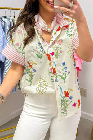 Charming floral print button-down shirt with ruffled collar and pink striped sleeves.