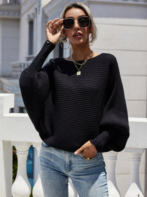 Black ribbed dolman knit sweater with boat neck and balloon sleeves.