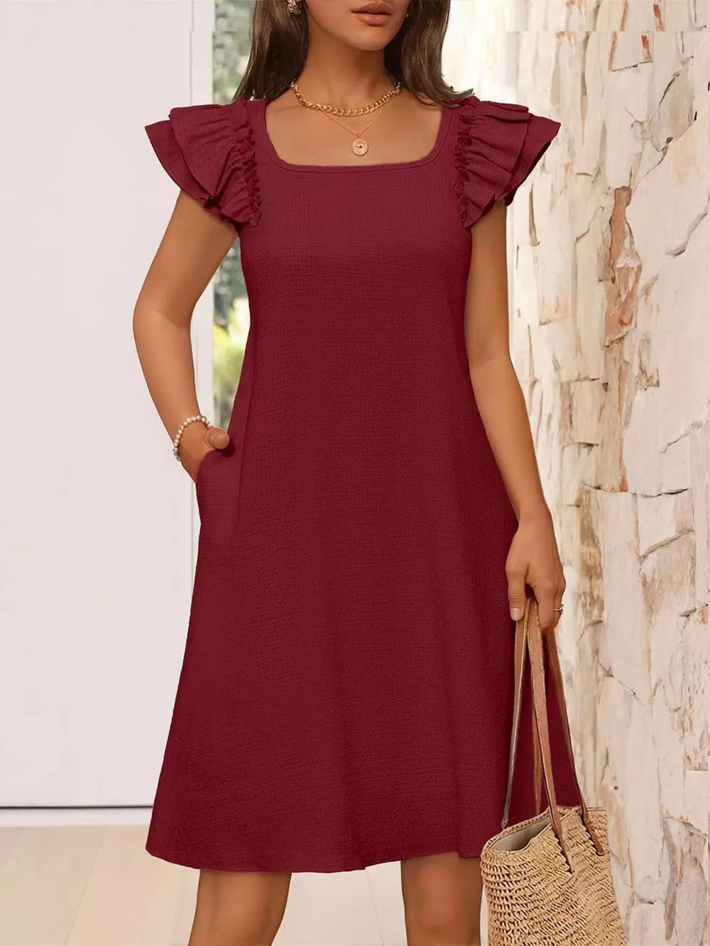 Burgundy a-line dress with ruffled cap sleeves and square neckline, featuring pockets.