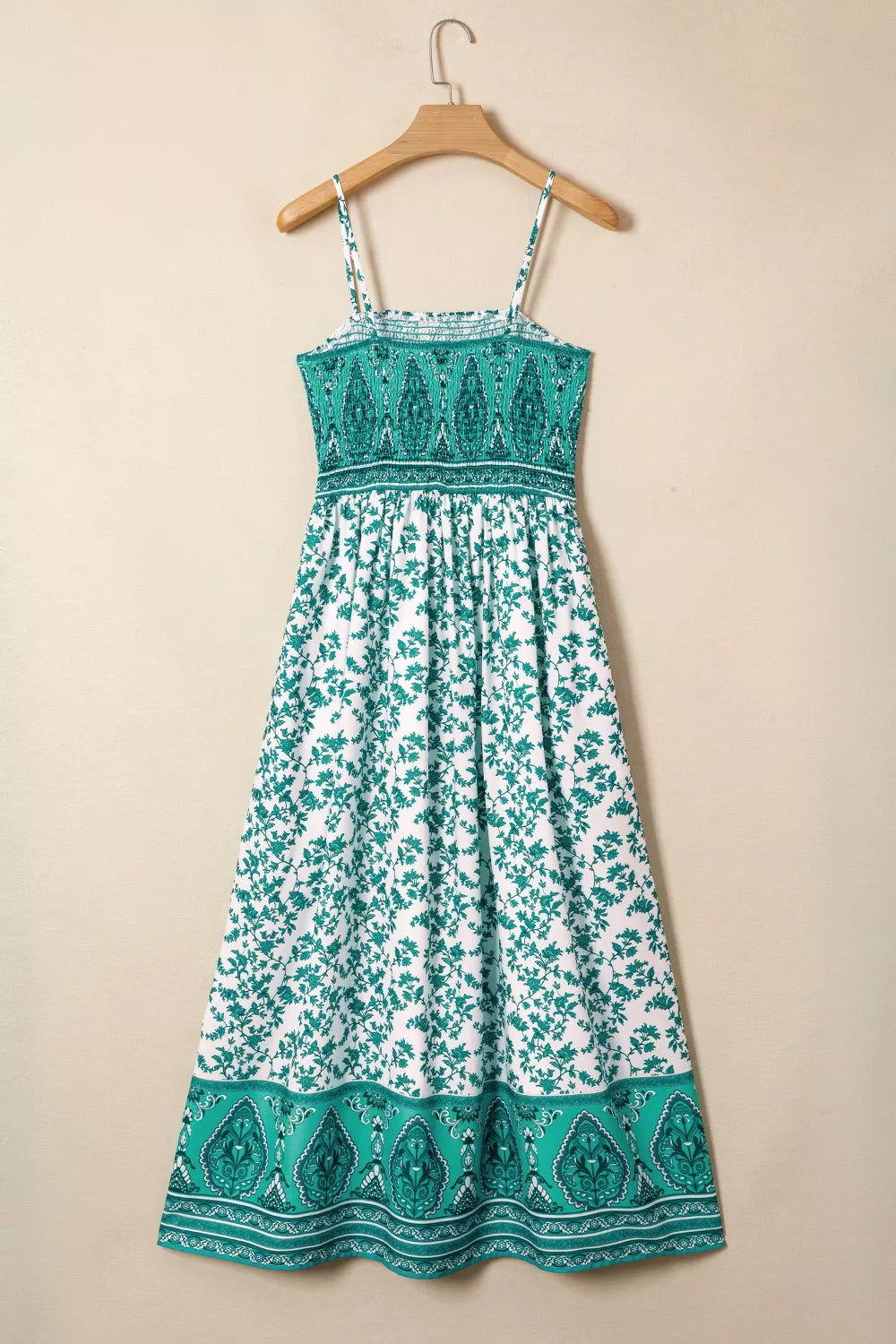 Shirred cami maxi dress with white and green floral print and ornate border.