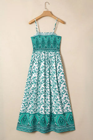 Shirred cami maxi dress with white and green floral print and ornate border.