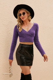 Purple plush wrap crop sweater with long sleeves and V-neck, acrylic knit.