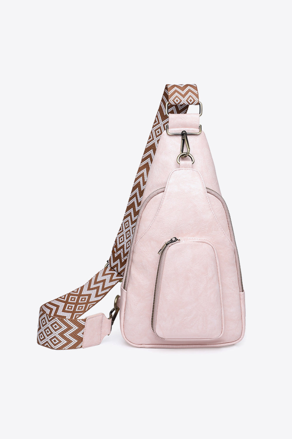 Blush pink PU sling bag with geometric strap and front zip pocket.