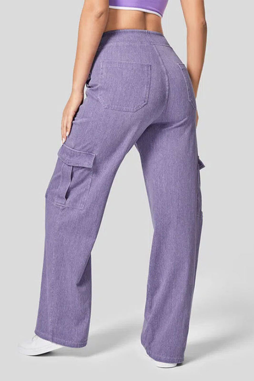 Lilac denim wide-leg cargo pants with flap pockets and a relaxed fit.