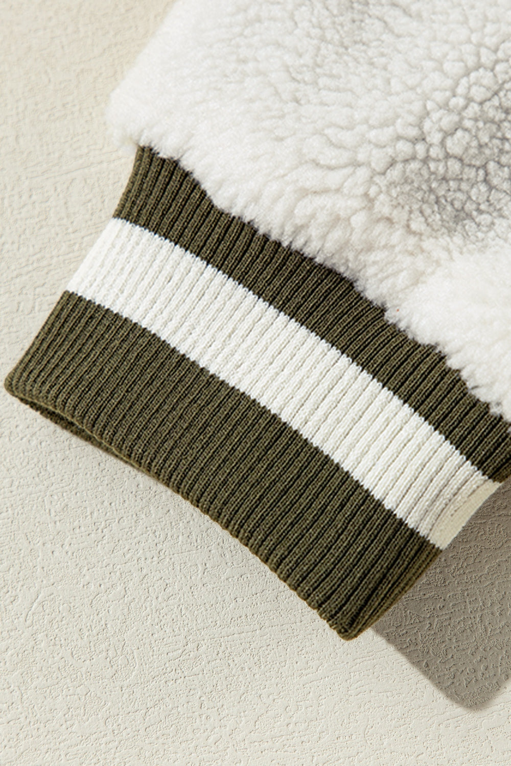 Moss corduroy varsity jacket sleeve with sherpa lining and striped rib knit cuff