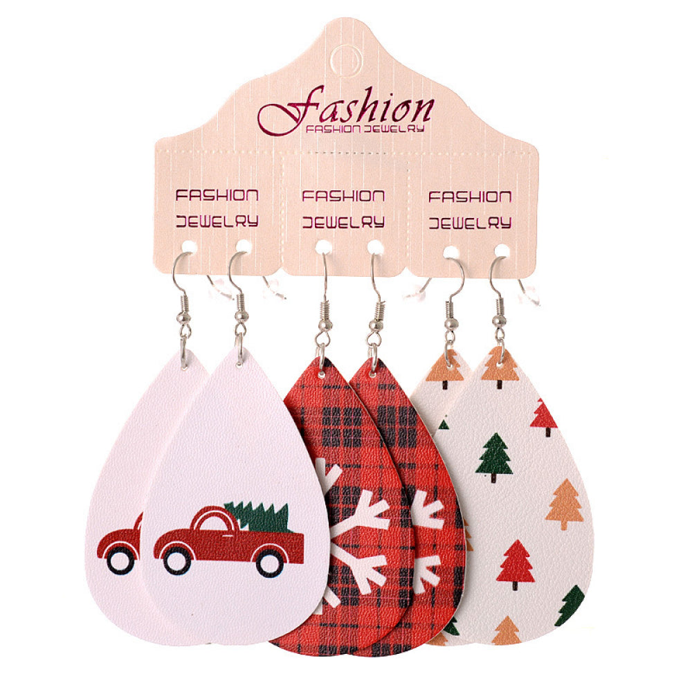 Festive drop earrings set with car, plaid, and tree prints.