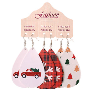 Festive drop earrings set with car, plaid, and tree prints.