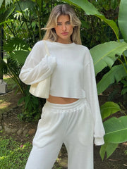 White waffle knit cropped lounge set with crew neck and long sleeves.
