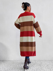 Striped knit maxi cardigan with red, cream, and brown blocks, long sleeves, and open front.