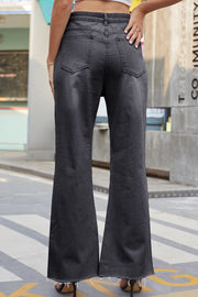 Distressed knee flare denim trousers in dark wash, featuring a frayed hem.