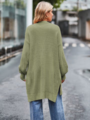 Open-stitch waffle knit duster cardigan in Matcha Green with side slits and balloon sleeves.