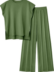 Matcha green knit co-ord set with wide-leg pleated pants and a cap-sleeve top with side slits.