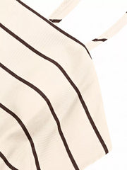 Apricot striped maternity swim dress with smocked detail and cutout.