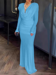 Blue ruched long-sleeve maxi dress with cowl neck and fitted skirt.