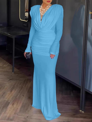Blue ruched long-sleeve maxi dress with cowl neck and fitted skirt.